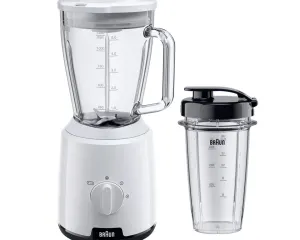 White Braun blender with a glass pitcher and a separate travel cup on a white background; dial on the base is visible.