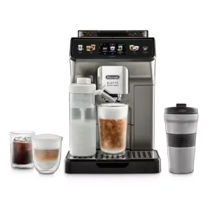 Coffee machine with built-in grinder and touch screen, brewing a frothy beverage into a tall glass cup and a secondary milk pitcher to the side.