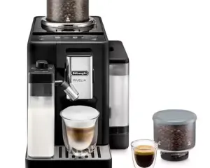 De'Longhi Rivella espresso machine with milk frother and bean hopper, a glass of espresso on the drip tray, and extra bean container beside it.