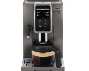 DeLonghi Dinamica Plus espresso machine with a glass coffee carafe on the drip tray