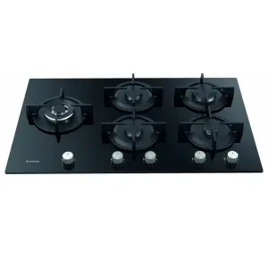 Black glass gas cooktop with five burners and five silver control knobs along the front.