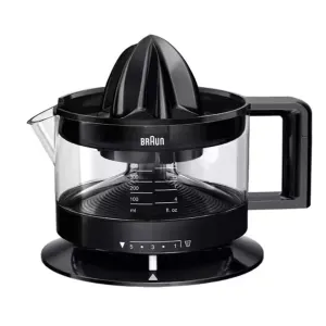 Braun electric citrus juicer with a glass juice container and black base, spout on the side, and reamer on top