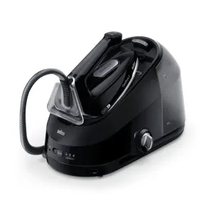 Black Braun steam generator iron with attached water tank and hose, angled for use on laundry tasks.