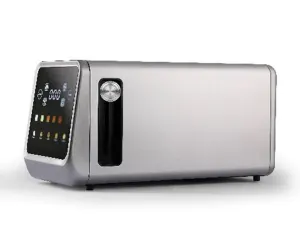 Modern stainless steel toaster oven with a black front control panel and a circular dial on the left side of the door area, placed on a countertop.