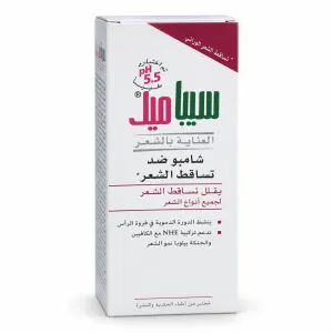 عبوة شامبو مضاد لتساقط الشعر مع علامة pH 5.5 وتفاصيل المنتج بالعربية على صندوق أبيض وأرجواني وأخضر مثلث أعلى اليمين